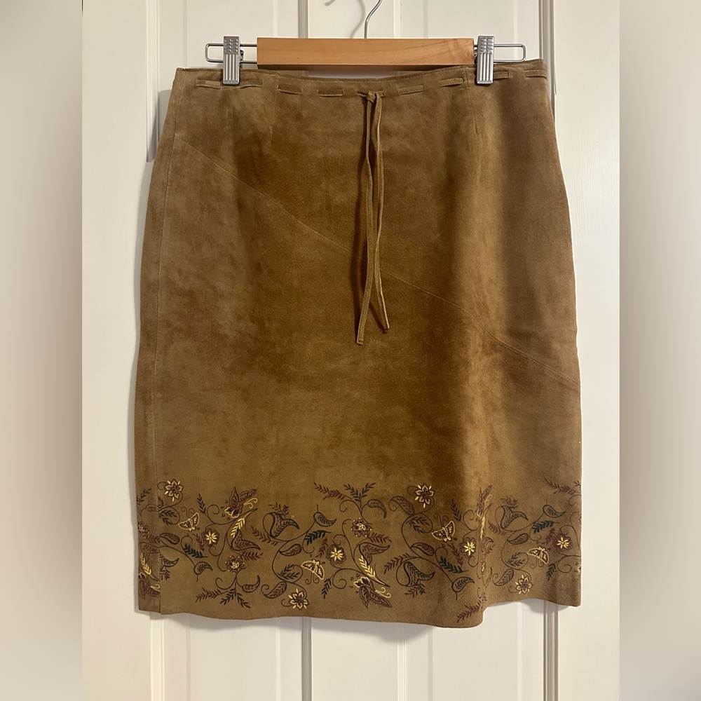 Express suede skirt with floral design on hemline